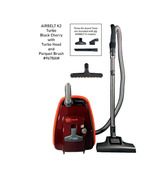 Red vacuum cleaner with attachments on a white background