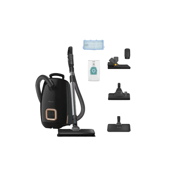 Black vacuum cleaner with attachments on a white background
